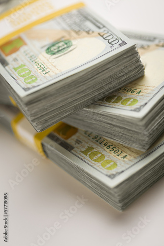Photo: Stacks of Newly Designed One Hundred Dollar Bills Stacks of Newly Designed One Hundred Dollar Bills