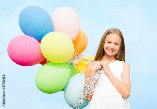 Photo: happy girl with colorful balloons happy girl with colorful balloons