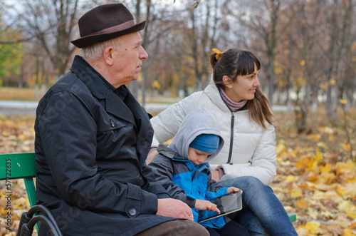 Photo: Three generations of a family at the park Three generations of a family at the park