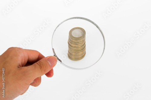 Photo: Magnifying Glass Focused on Coins Magnifying Glass Focused on Coins