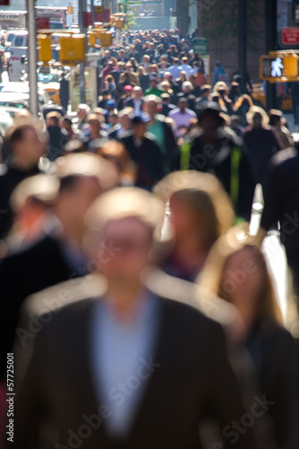 Photo: Anonymous crowd walking on a street in New York Anonymous crowd walking on a street in New York