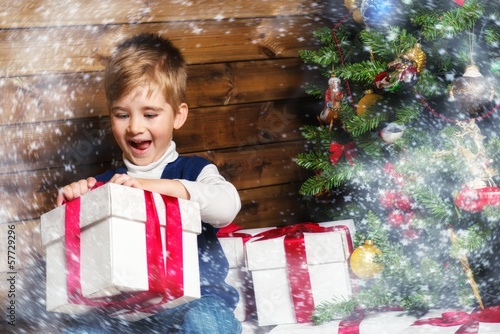 Photo: Happy little boy with gift box Happy little boy with gift box