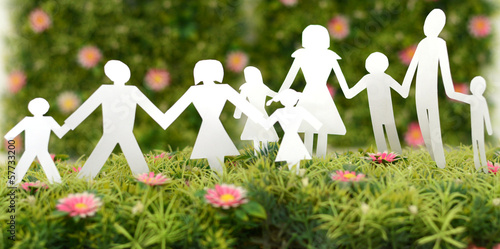 Photo: Family from paper on grass Family from paper on grass