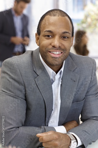 Photo: Portrait of confident businessman smiling Portrait of confident businessman smiling