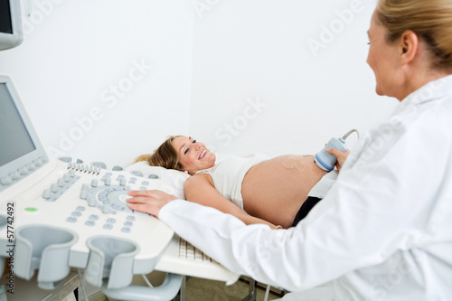 Photo: Doctor Performing An Ultrasound Scan Doctor Performing An Ultrasound Scan