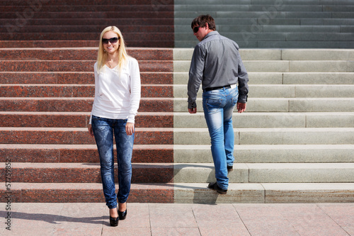 Photo: Young fashionable couple on the steps Young fashionable couple on the steps