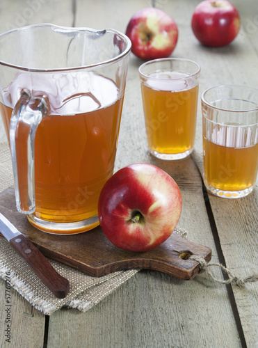 Photo: Apple juice and red apples Apple juice and red apples