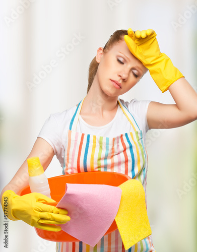 Photo: young housewife is tired of housework young housewife is tired of housework
