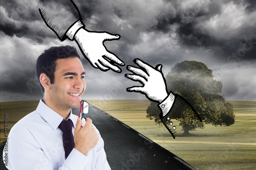 Photo: Composite image of smiling businessman holding glasses Composite image of smiling businessman holding glasses