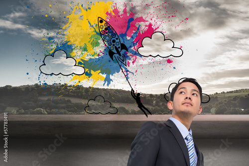Photo: Composite image of serious asian businessman Composite image of serious asian businessman