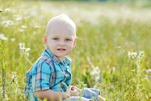 Photo: boy in green grass boy in green grass