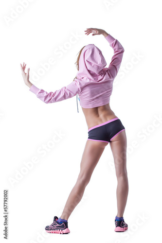 Photo: Slim muscular woman posing back to camera Slim muscular woman posing back to camera