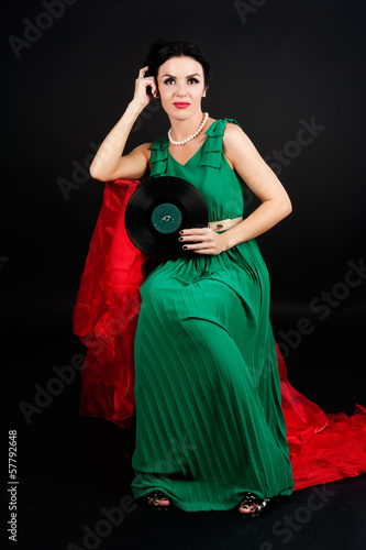 Photo: Pretty girl holding vinyl disc Pretty girl holding vinyl disc