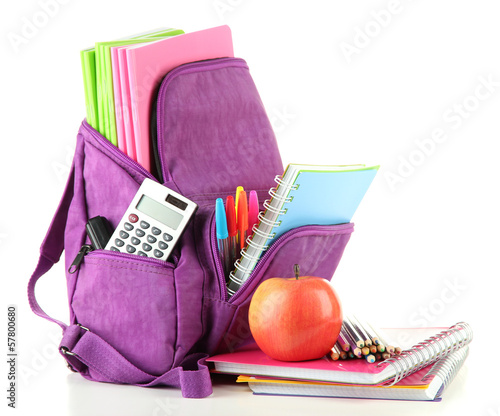 Photo: Purple backpack with school supplies isolated on white Purple backpack with school supplies isolated on white