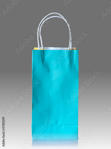 Photo: paper bag on reflect floor and gray background paper bag on reflect floor and gray background