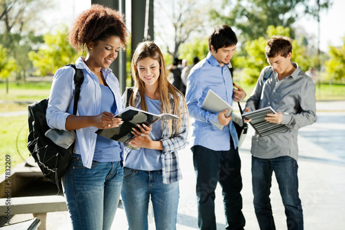 Photo: Students Reading Books In University Campus Students Reading Books In University Campus