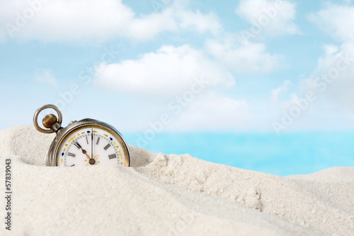 Photo: Antique watch in the sand Antique watch in the sand