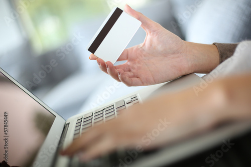 Photo: Hand holding credit card to buy online Hand holding credit card to buy online