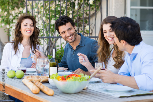Photo: Group Of Friends Having Dinner Group Of Friends Having Dinner