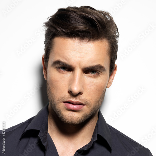 Photo: Fashion portrait of young man in black shirt Fashion portrait of young man in black shirt