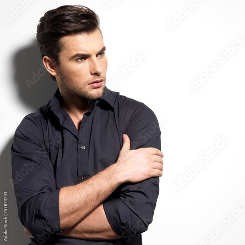 Photo: Fashion portrait of young man in black shirt Fashion portrait of young man in black shirt