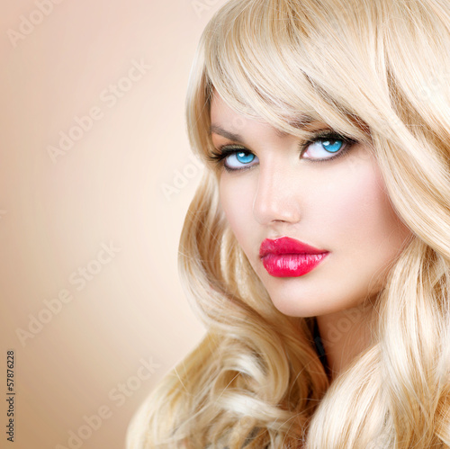 Photo: Blonde Woman Portrait. Beautiful Blond Girl with Long Wavy Hair Blonde Woman Portrait. Beautiful Blond Girl with Long Wavy Hair