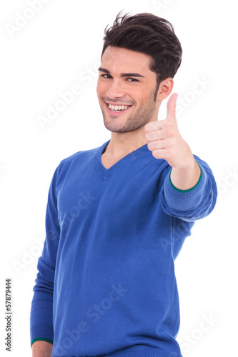 Photo: smiling man making the ok thumbs up sign smiling man making the ok thumbs up sign