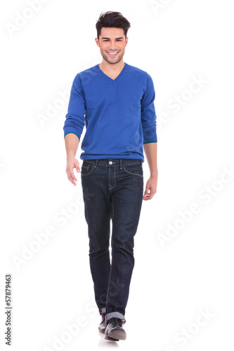 Photo: young man walking forwards towards the camera young man walking forwards towards the camera