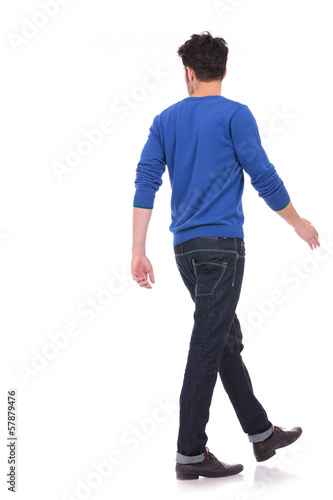 Photo: back view of a walking casual man looking to a side back view of a walking casual man looking to a side