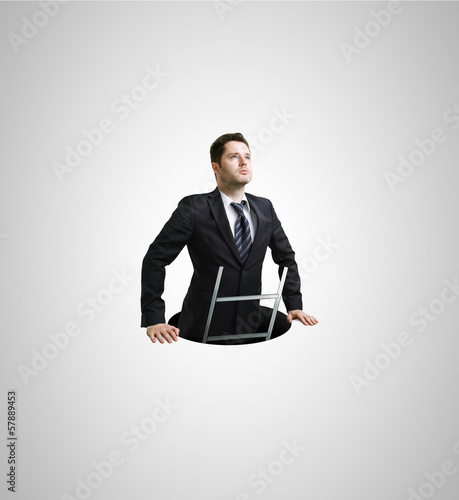 Photo: Businessman in hole Businessman in hole