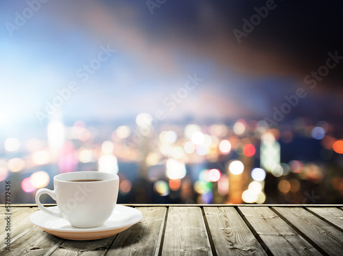 Photo: coffee on table in the night city coffee on table in the night city
