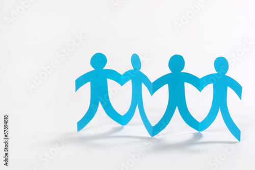 Photo: teamwork, blue paper people on white teamwork, blue paper people on white