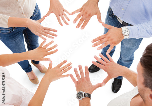 Photo: Friends Making Circle Shape With Hand Friends Making Circle Shape With Hand