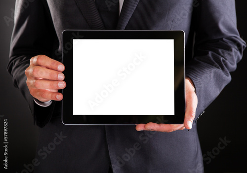 Photo: Businessman Holding Digital Tablet Businessman Holding Digital Tablet