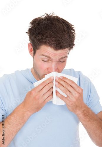 Photo: Young Man Blowing His Nose Young Man Blowing His Nose