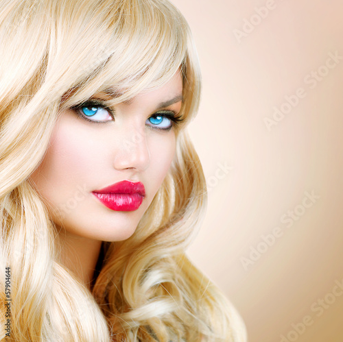 Photo: Blonde Woman Portrait. Beautiful Blond Girl with Long Wavy Hair Blonde Woman Portrait. Beautiful Blond Girl with Long Wavy Hair