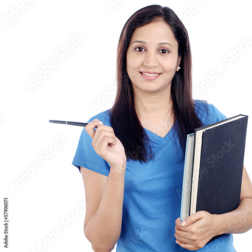Photo: Young female Indian student with books Young female Indian student with books