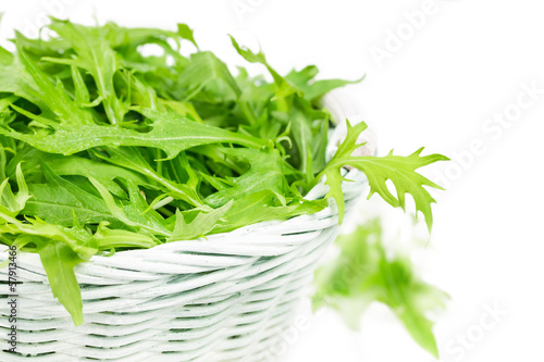 Photo: Arugula salad in a wicker basket Arugula salad in a wicker basket