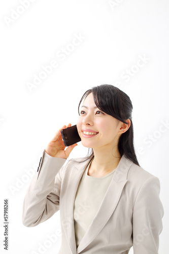 Photo: スマートフォンで連絡するビジネスウーマン スマートフォンで連絡するビジネスウーマン