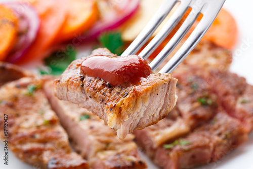 Photo: Piece of steak on fork Piece of steak on fork