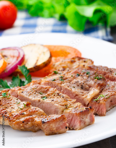 Photo: Steak with grilled vegetables on a plate Steak with grilled vegetables on a plate