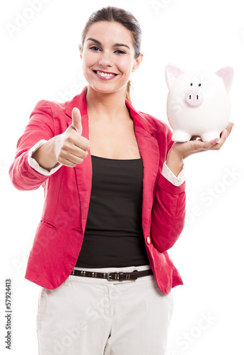 Photo: Business woman with a piggy bank Business woman with a piggy bank