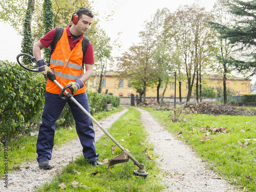 Photo: man working edge trimmer man working edge trimmer