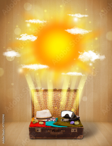 Photo: Summer bright sun with clouds and tourist bag Summer bright sun with clouds and tourist bag