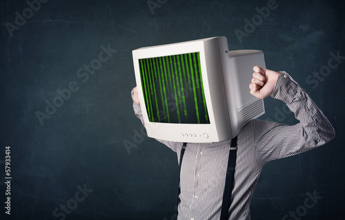 Photo: Cyber human with a monitor screen and computer code on the displ Cyber human with a monitor screen and computer code on the displ