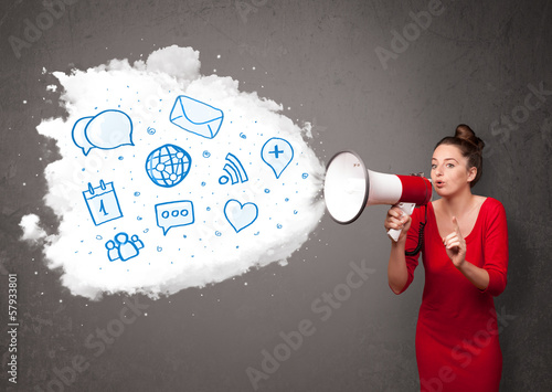 Photo: Woman shouting into loudspeaker and modern blue icons and symbol Woman shouting into loudspeaker and modern blue icons and symbol