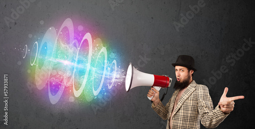 Photo: Man yells into a loudspeaker and colorful energy beam comes out Man yells into a loudspeaker and colorful energy beam comes out