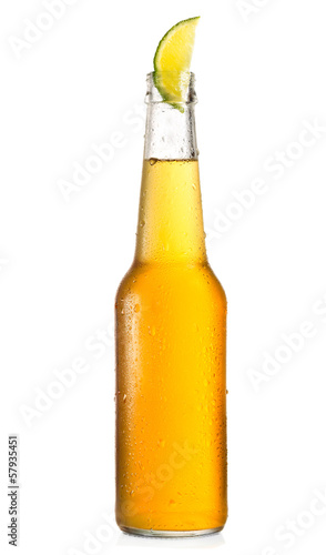 Photo: bottle of beer with lime bottle of beer with lime
