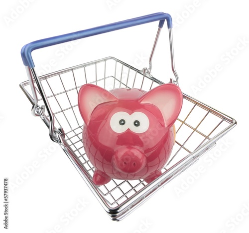 Photo: A piggy bank looking out of a metal shopping basket A piggy bank looking out of a metal shopping basket