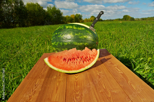 Photo: Watermelon slices on a wooden table Watermelon slices on a wooden table